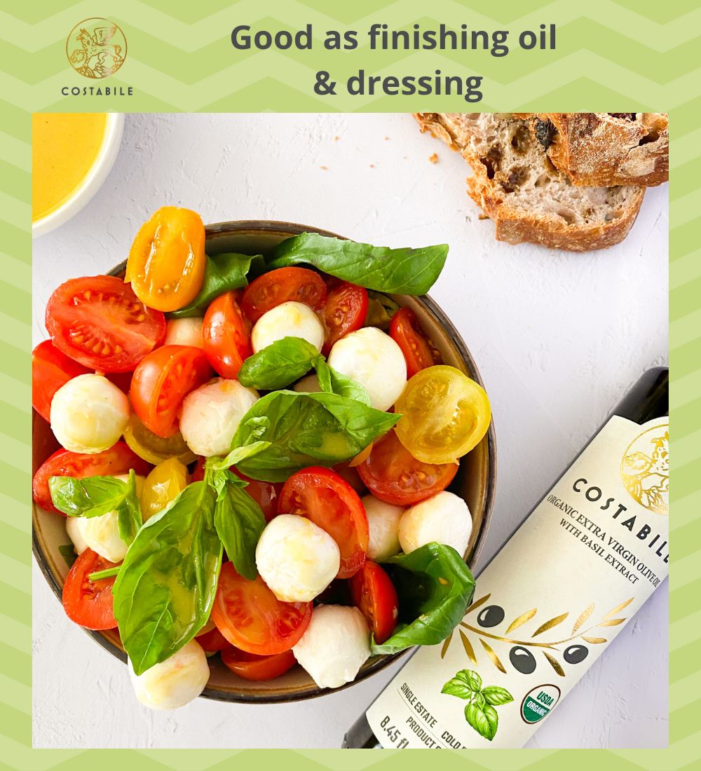 Basil infused olive oil extra virgin from Puglia Italy can be used as dressing oil on an italian mozzarella and tomato (caprese) salad