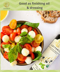 Basil infused olive oil extra virgin from Puglia Italy can be used as dressing oil on an italian mozzarella and tomato (caprese) salad