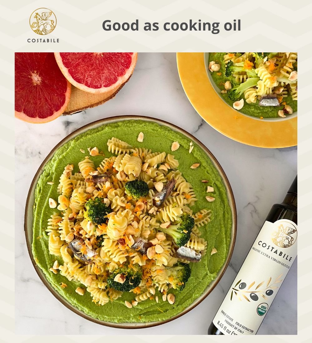 Organic extra virgin Olive Oil from Puglia Italy used as cooking oil on a pasta with anchovies broccoli and nuts dish